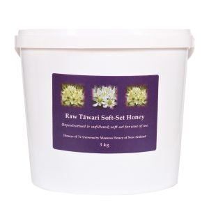 A 3kg white plastic pail of Raw Tāwari Soft-Set Honey by Manawa Honey of New Zealand, labeled unpasteurised and unfiltered.