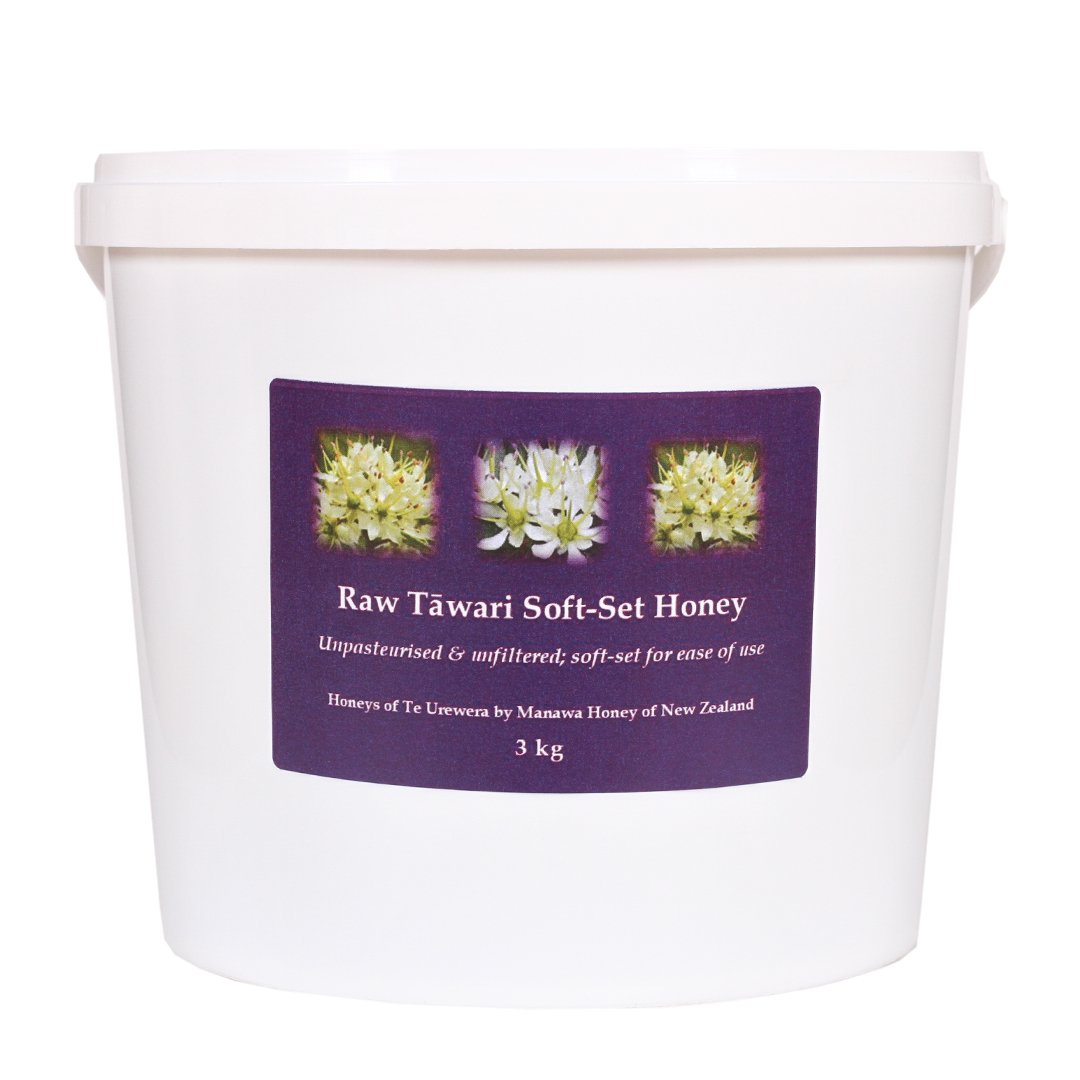 A 3kg white plastic pail of Raw Tāwari Soft-Set Honey by Manawa Honey of New Zealand, labeled unpasteurised and unfiltered.